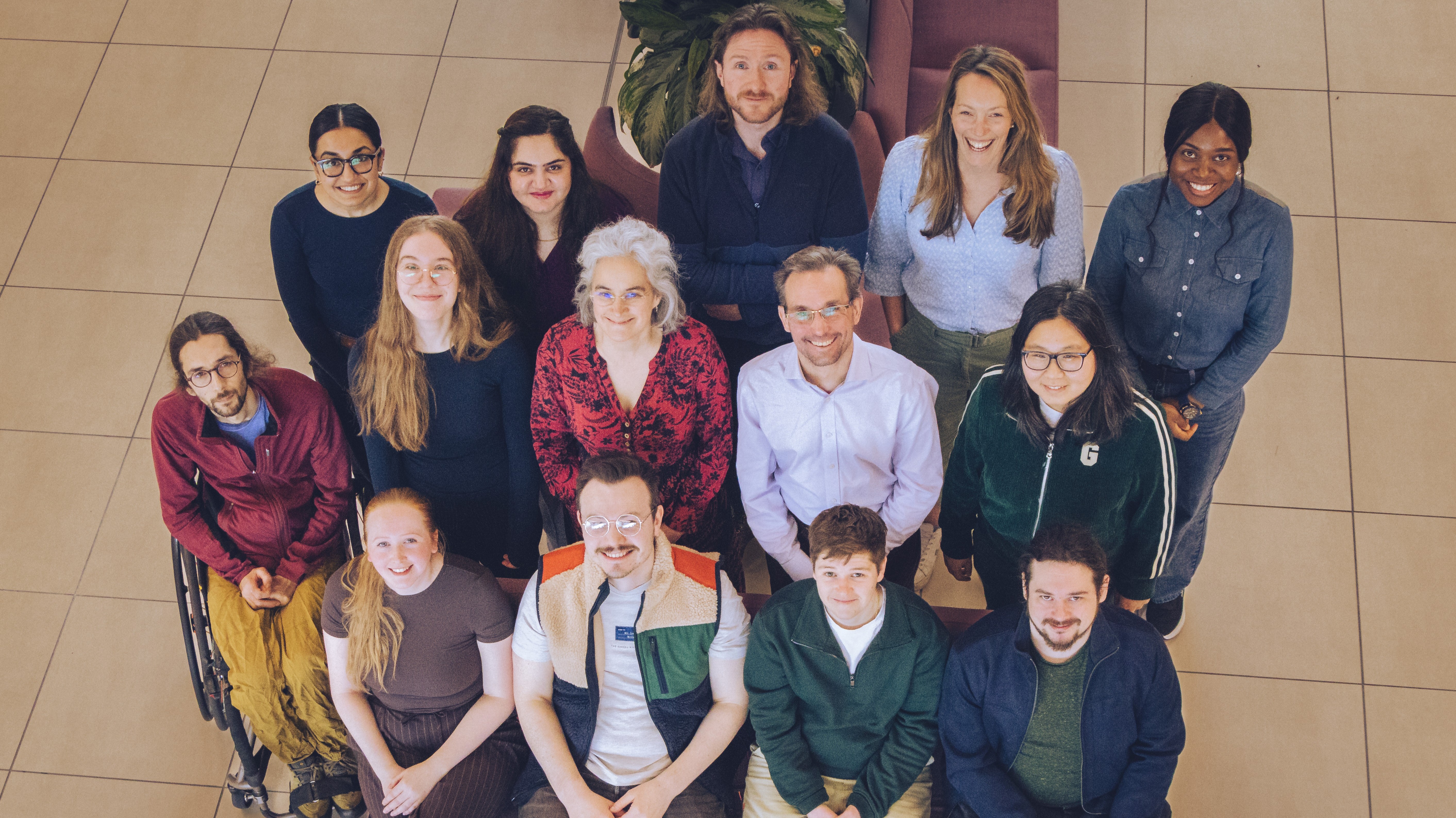 CHICAS members sat on wooden tiered steps
