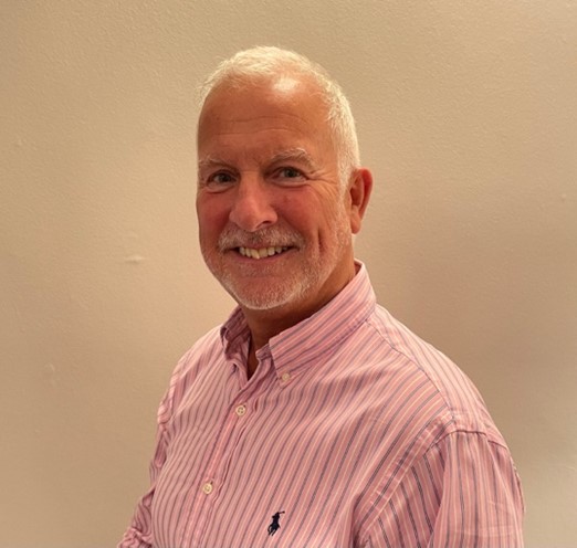 A photograph of Simon Bury