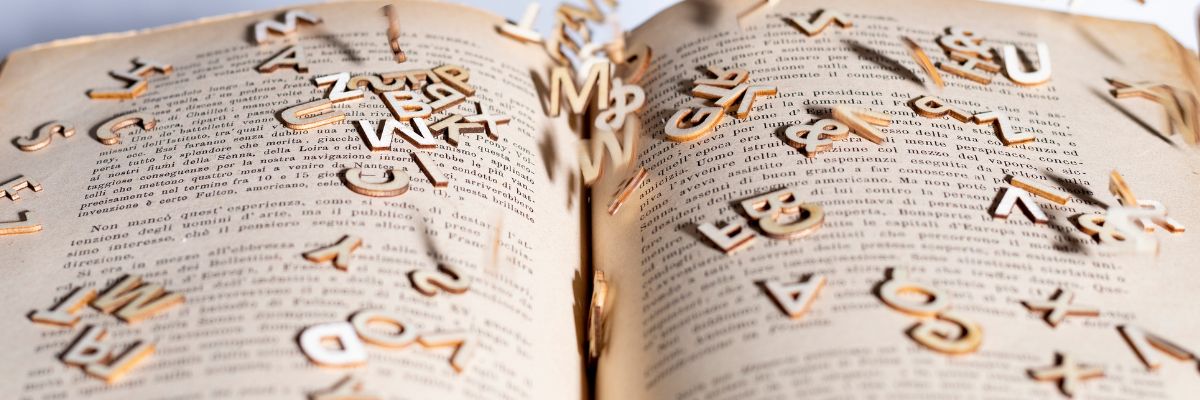 A book with jumbled letters on top of it