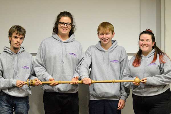 Students holding the debating mace