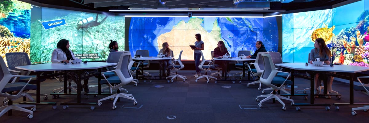 The Data Immersion suite at Lancaster features walls full screens, showing statistics.