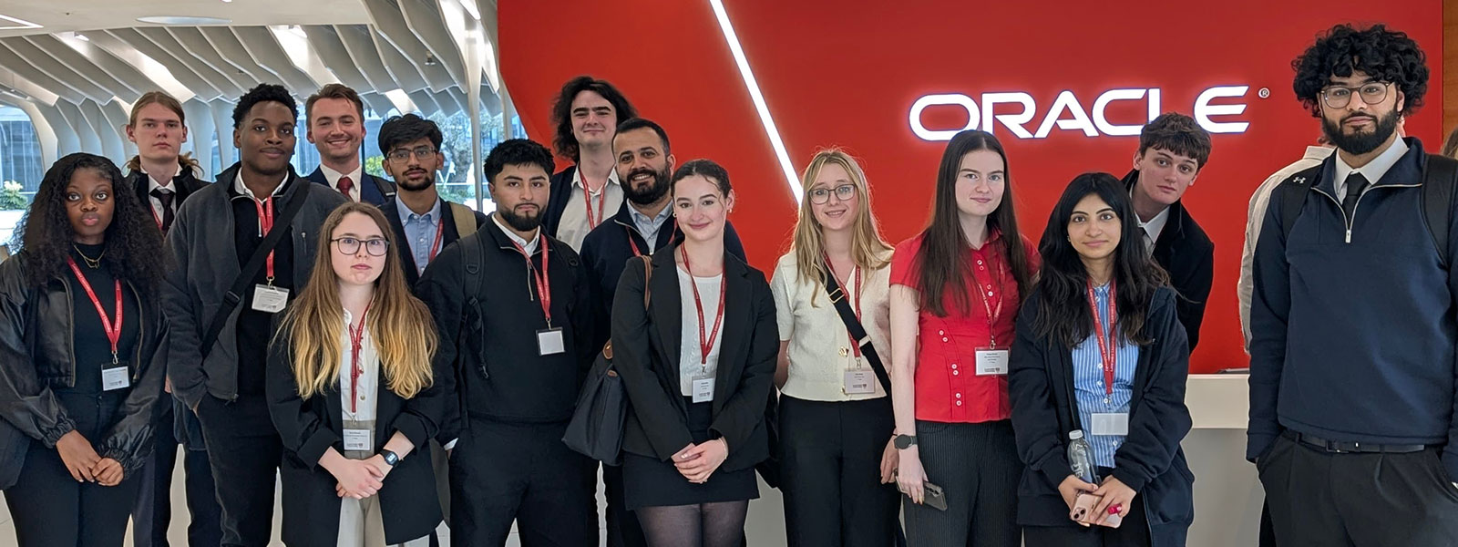 A group of students stand in the foyer of the Oracle offices on a visit during the Capital Connections trip to London