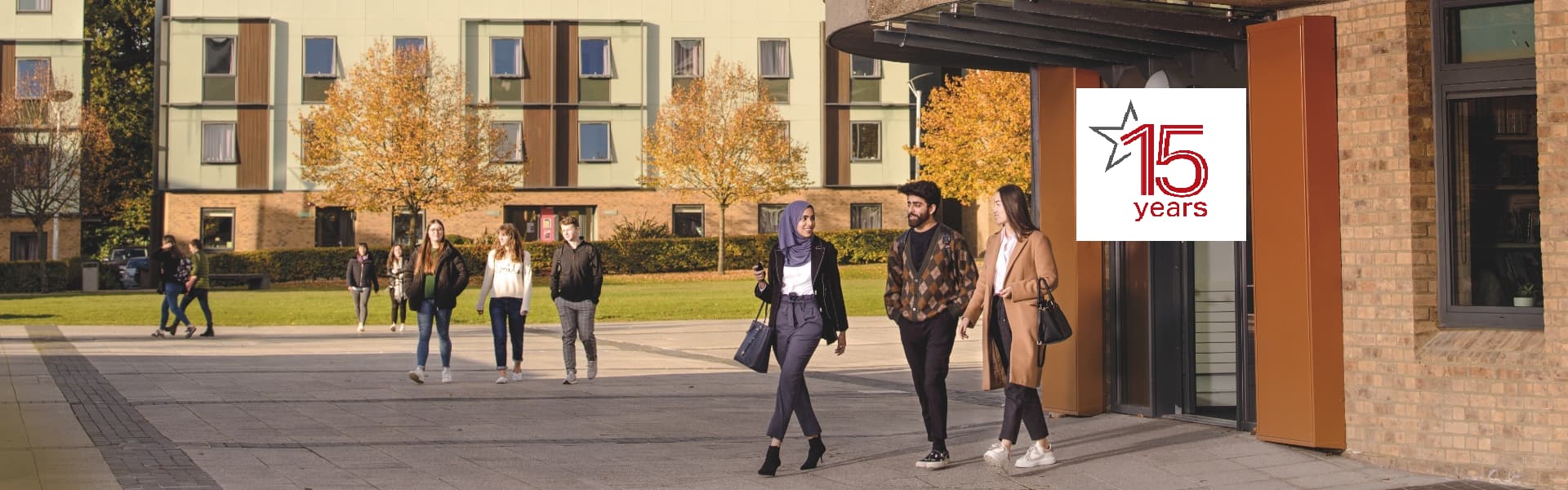 Students in front of the Roundhouse with LUCI 15th Anniversary logo