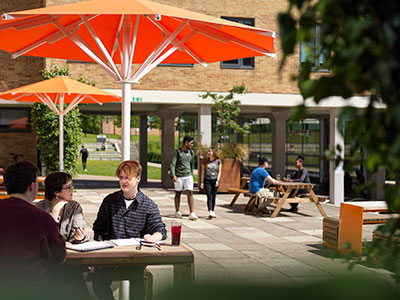 Students relaxing in a courtyard.