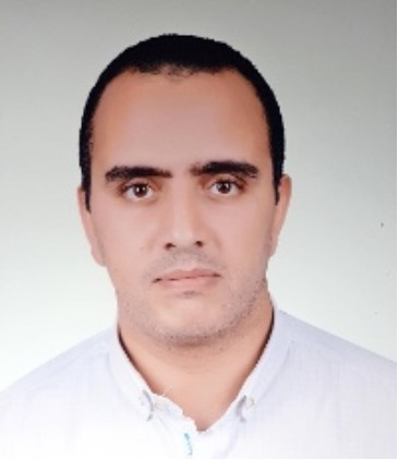 Head shot of Hesham Yousef, he has short dark hair and a serious expression.
