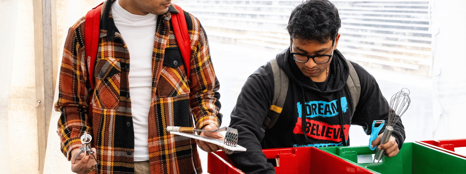 Two students buying items at the ECOMarket