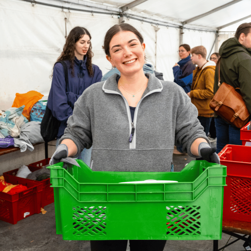 Student carrying donations